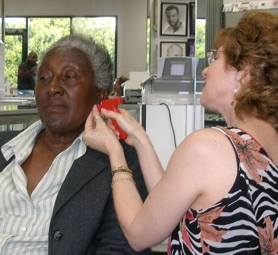 Janet Rothstein piercing Irenes ears